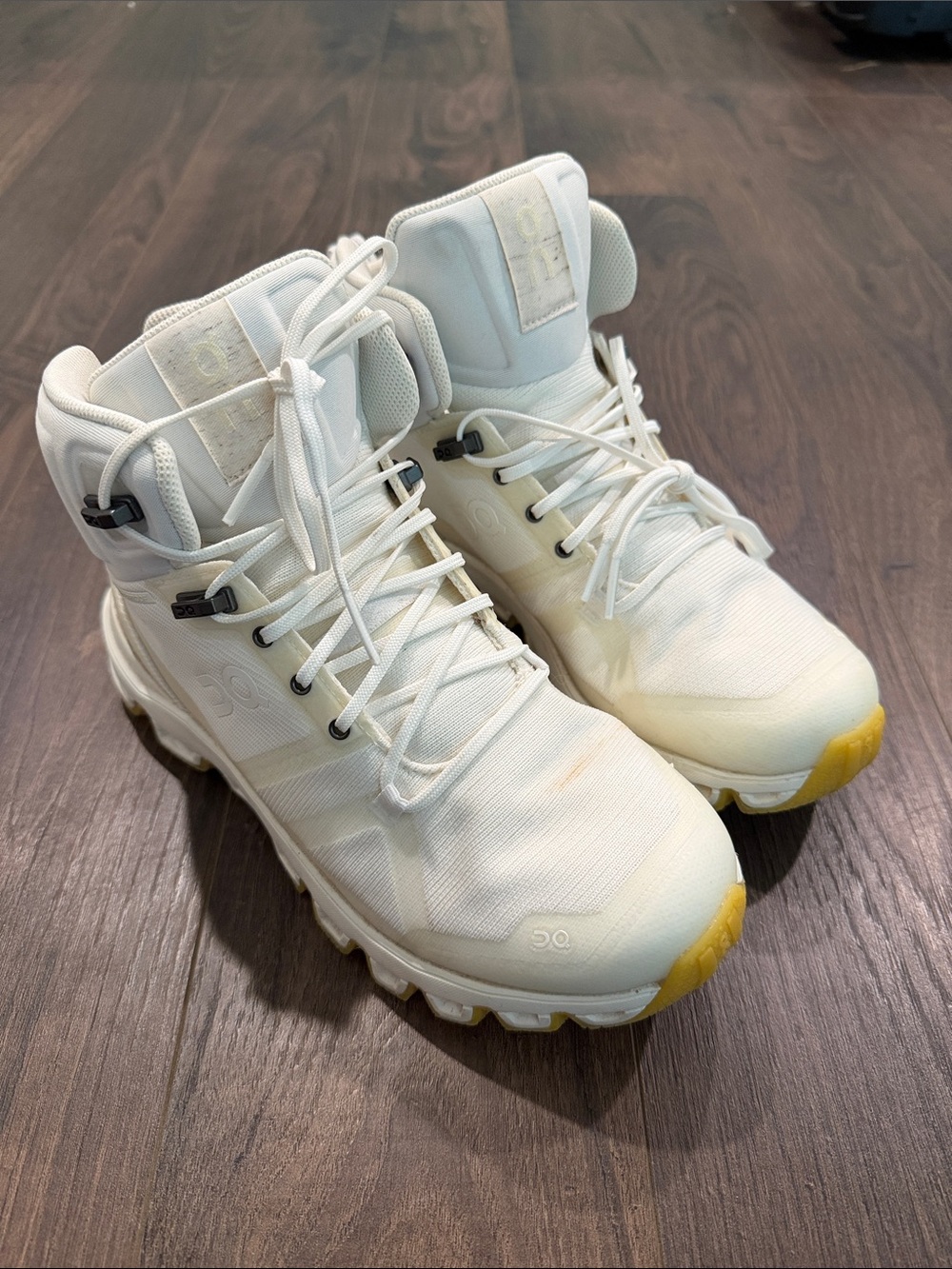 On Running White High-Top Athletic Boots with Yellow Accents